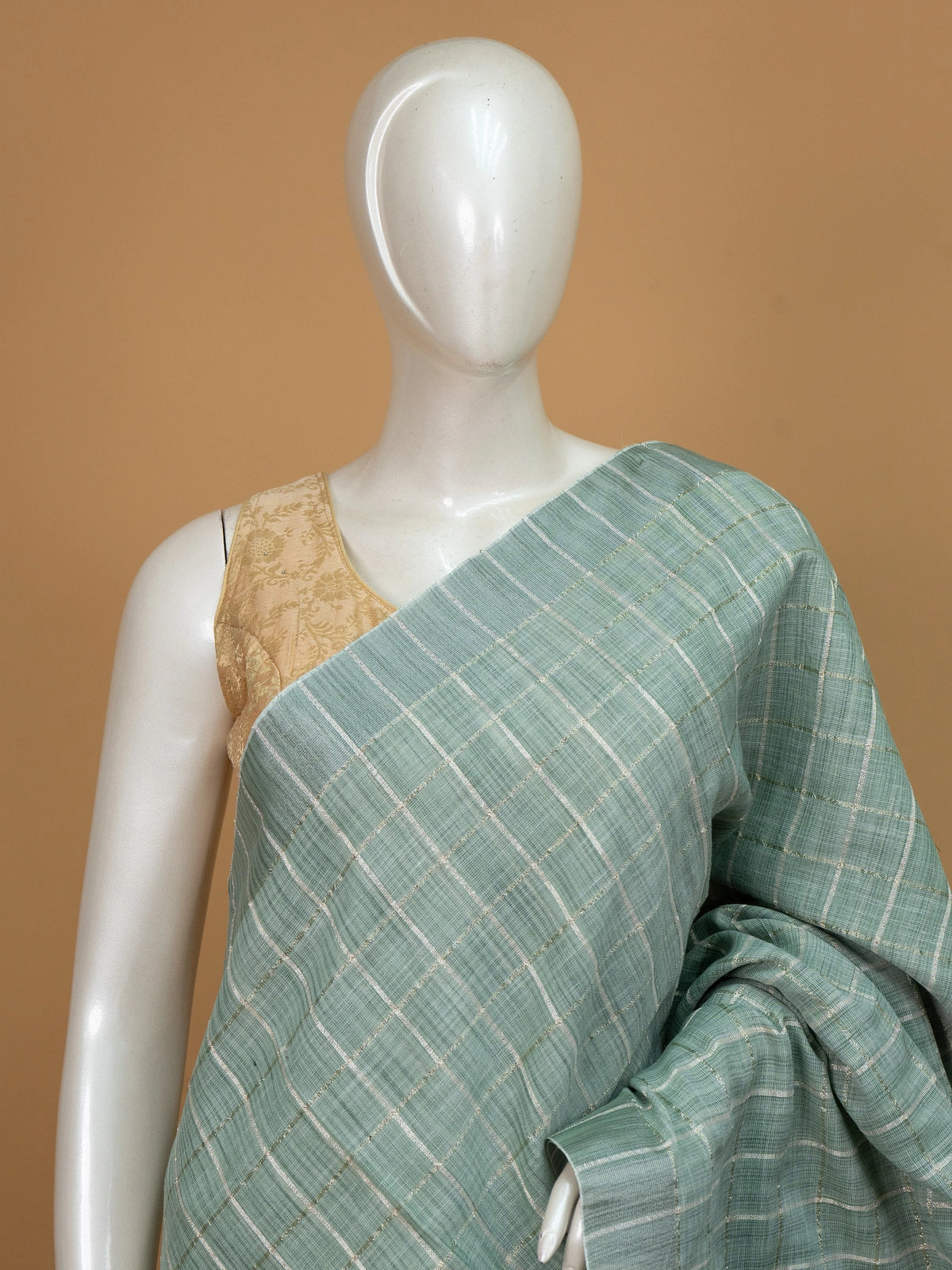 Sage green linen cotton saree with gold zari checked pattern and striped pallu