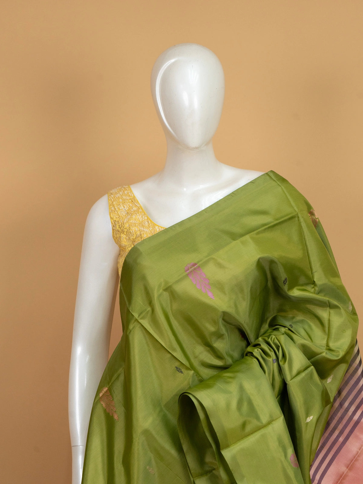 Olive green and peach Banana Silk saree with woven buttas and contrast striped pallu