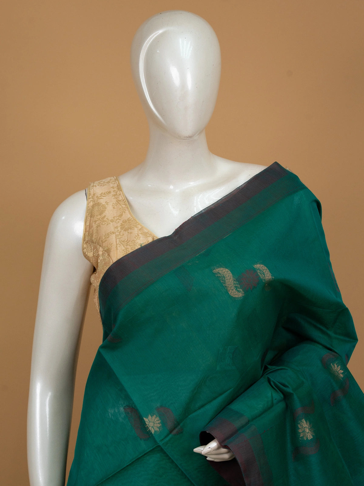 Teal green silk cotton saree with maroon gold zari border and paisley floral buttas