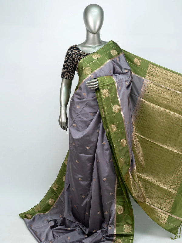 Grey semi silk saree with green contrast gold zari border and floral pallu