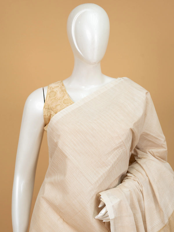 Cream and gold silk cotton saree with striped body, golden zari border and striped pallu