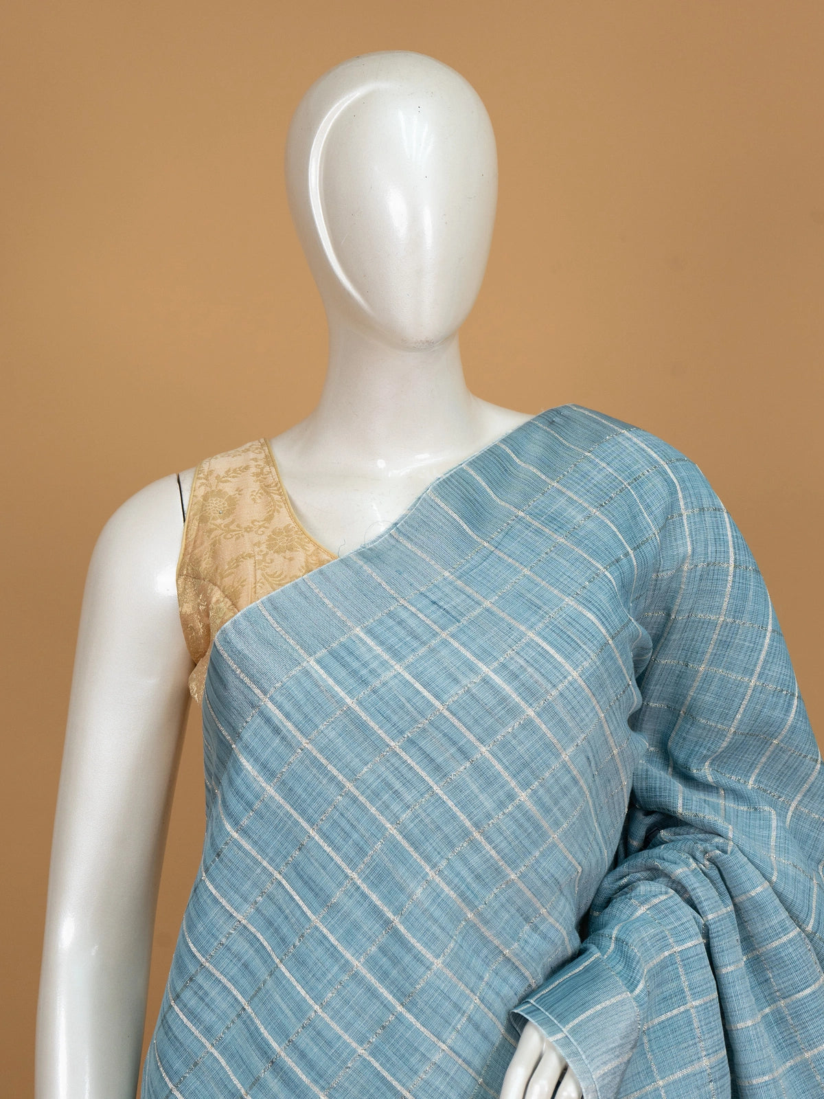 Sky blue linen cotton saree with white and silver zari checked weave and striped pallu