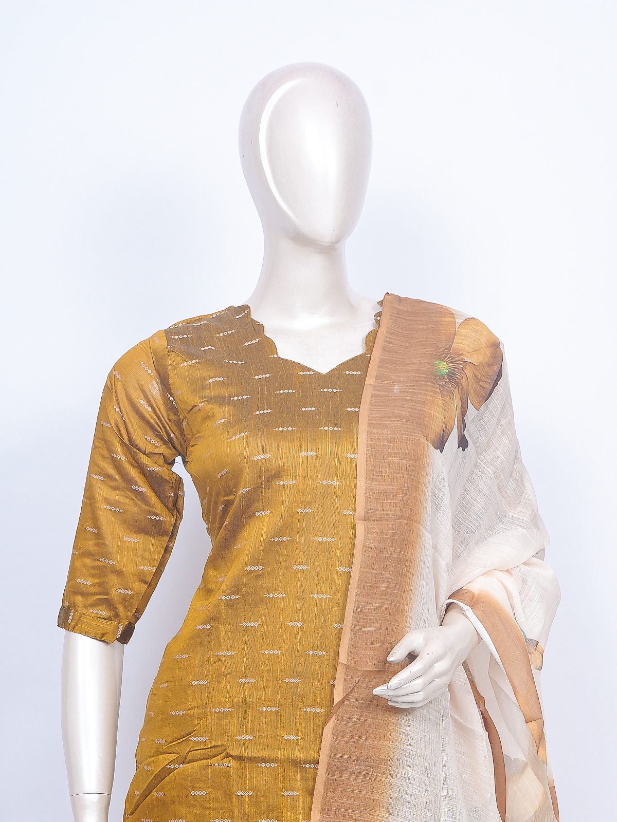 Mustard woven kurti set with beige pants and floral print cream dupatta