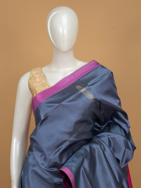 Grey-blue Banana Silk saree with contrast pink zari border and pallu