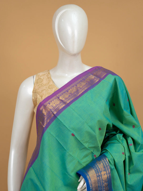 Green Chettinad cotton saree with contrast purple and blue zari borders and pink buttas