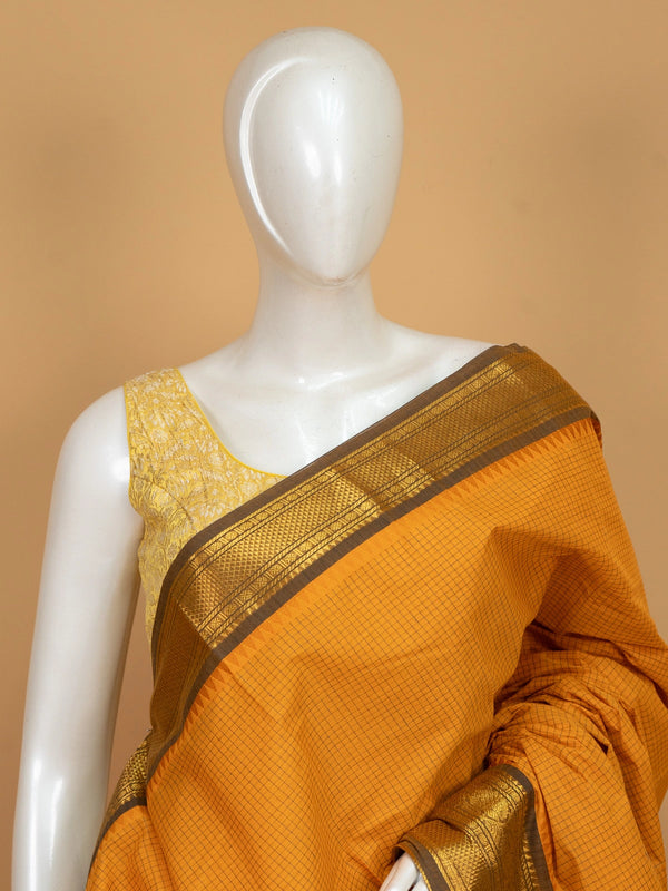 Mustard yellow Chettinad cotton saree with woven checks and contrast olive-brown gold zari border
