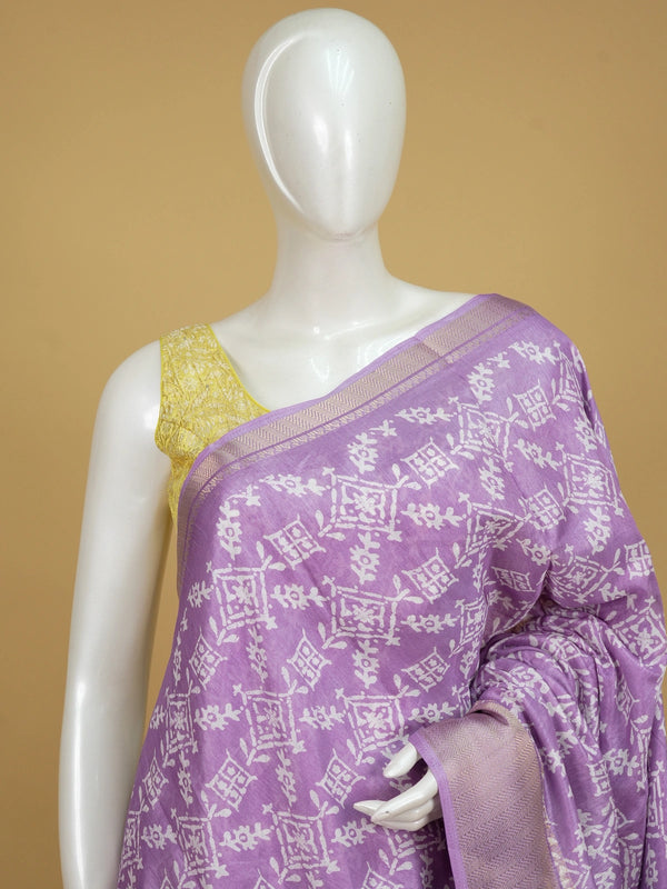 Lavender and white designer saree with batik-style print and zari border