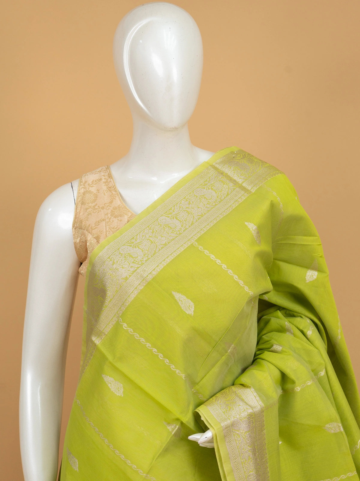 Lime green silk cotton saree with silver zari border and buttas