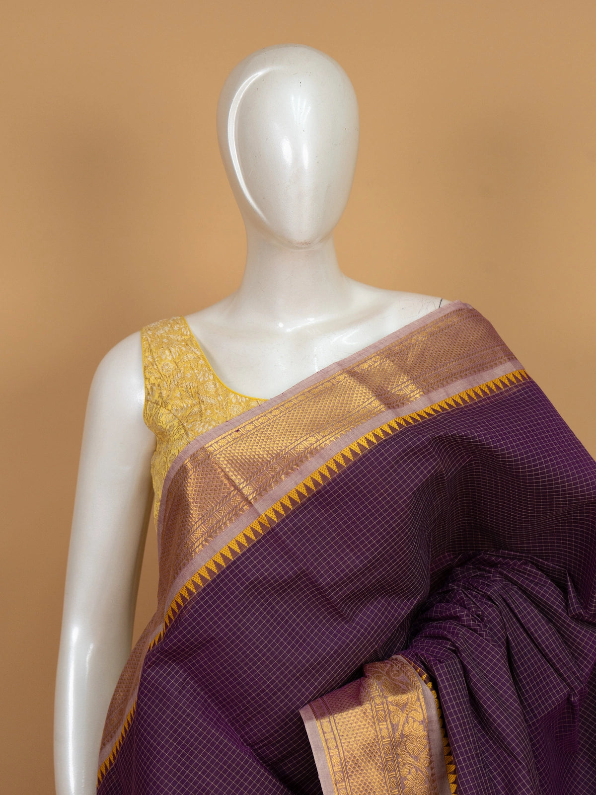 Purple Chettinad cotton saree with gold checked body and temple zari border