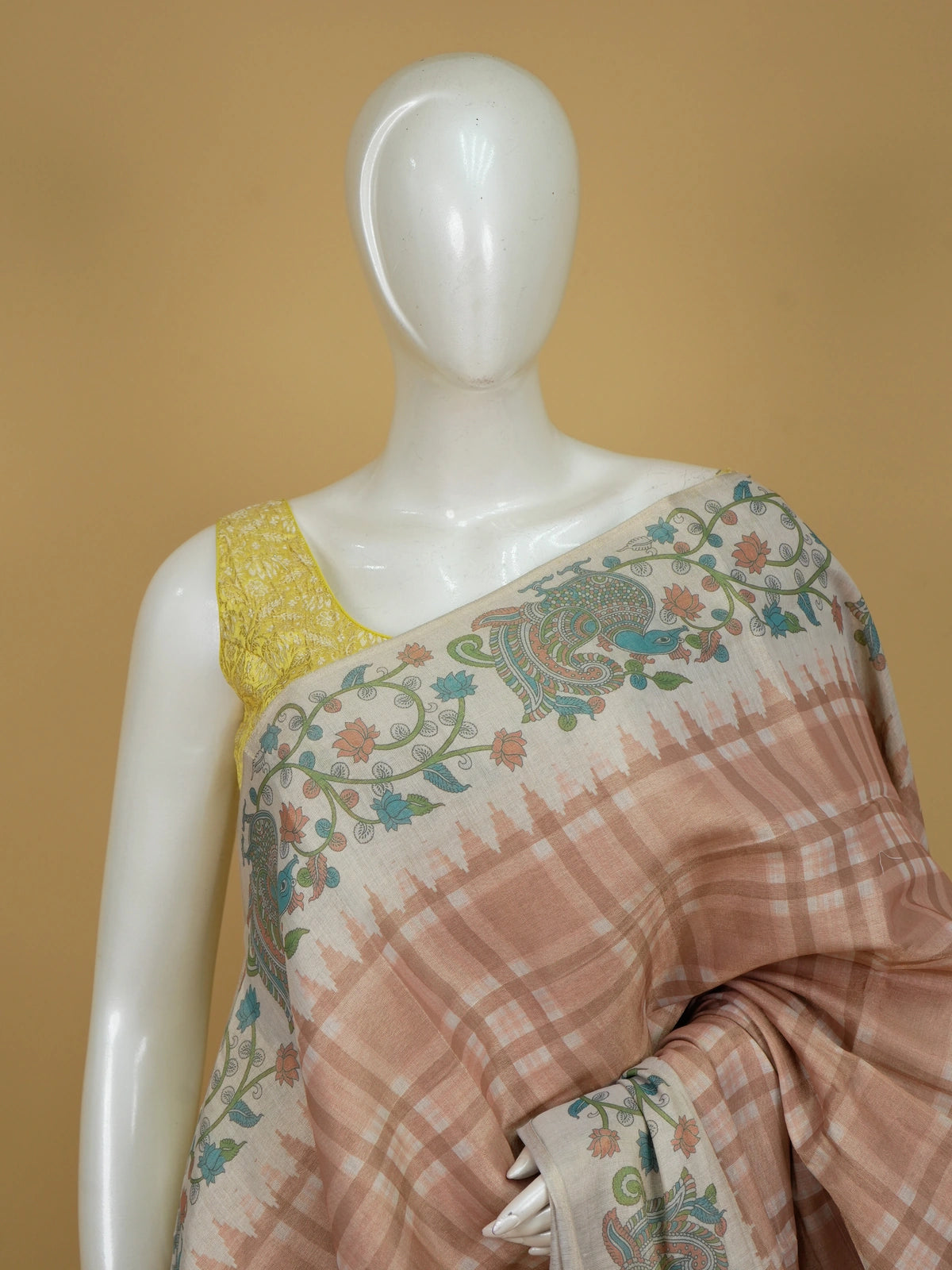 Peach beige and cream linen cotton saree with Kalamkari peacock pallu and checked body