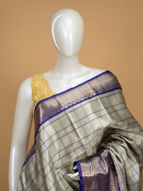 Sage green checked Kanchi semi silk saree with contrast violet gold zari border and pallu