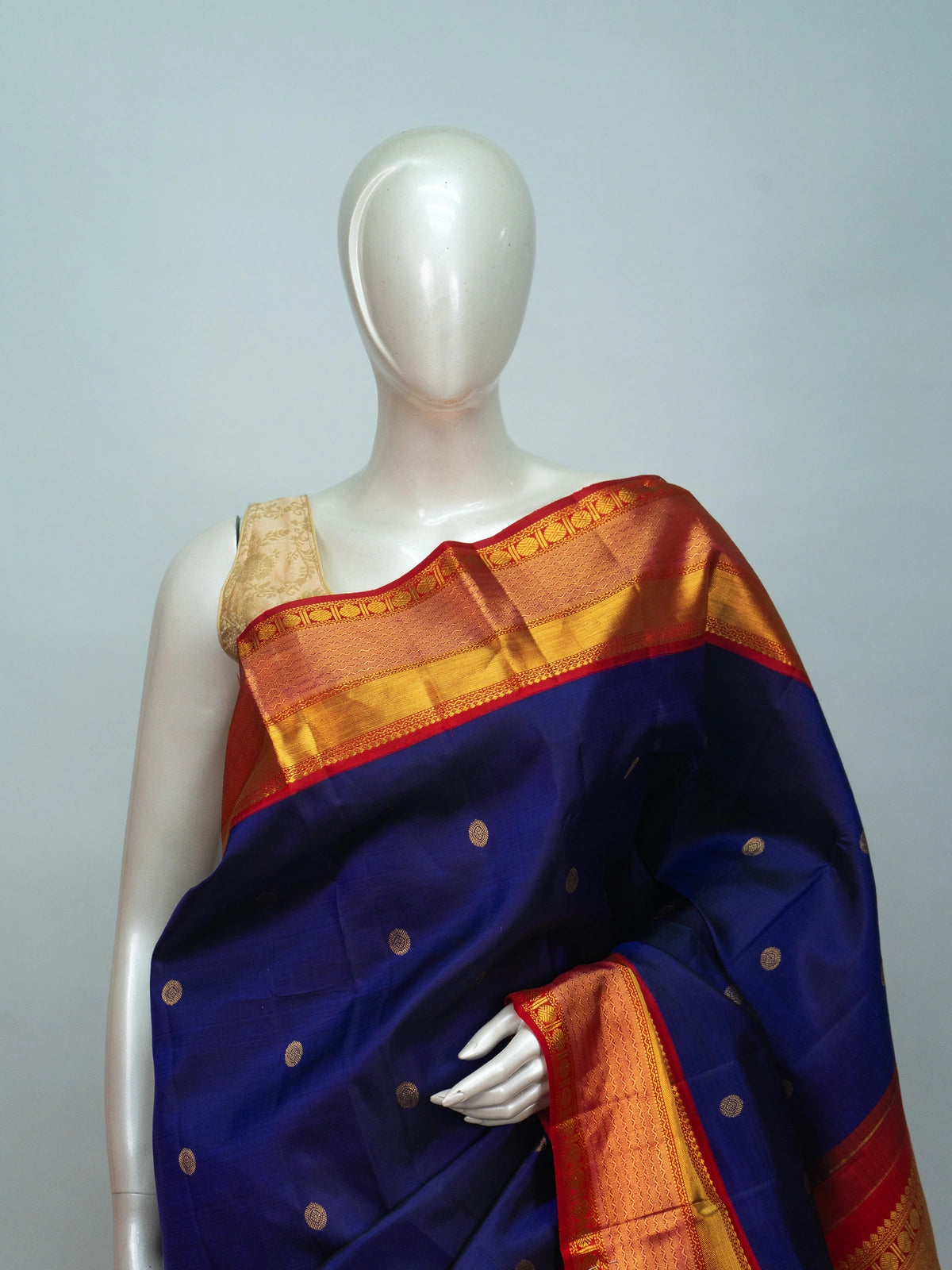 Navy blue pure Kanchipuram silk saree with contrast red gold zari border and pallu