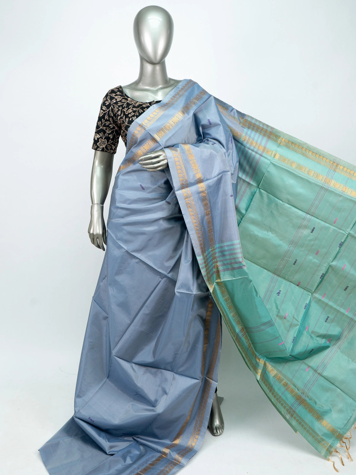 Dusty blue-grey Banana Silk saree with teal green contrast pallu and gold zari border