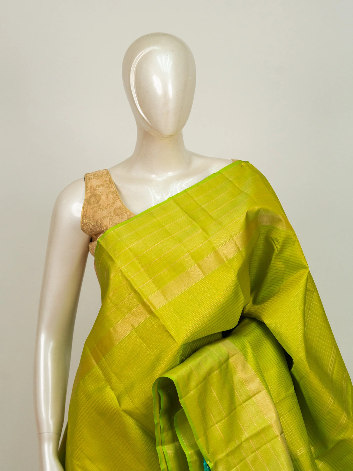 Parrot green Pure Kanchipuram silk saree with gold zari checks, gold zari border and contrasting teal pallu