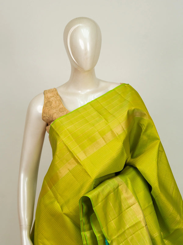 Parrot green Pure Kanchipuram silk saree with gold zari checks, gold zari border and contrasting teal pallu