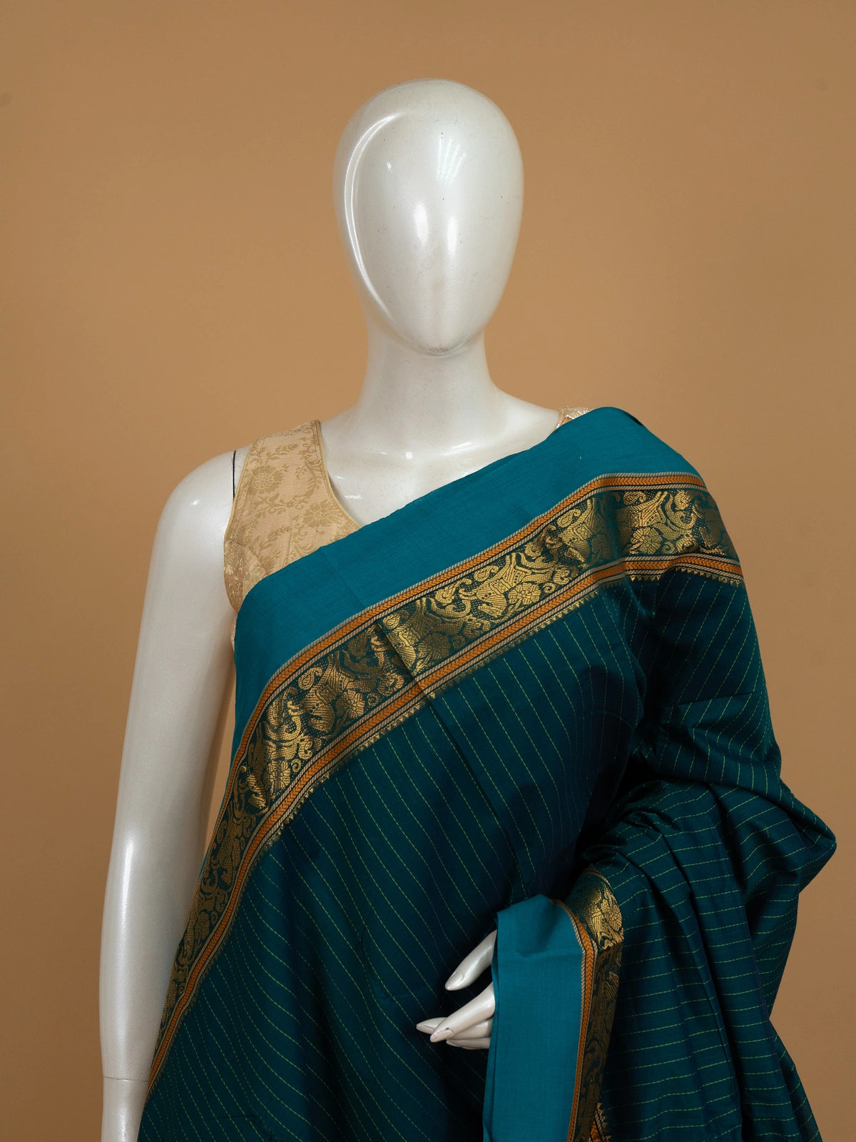 Teal blue Chettinad cotton saree with green pinstripes, gold zari border and contrast magenta pallu