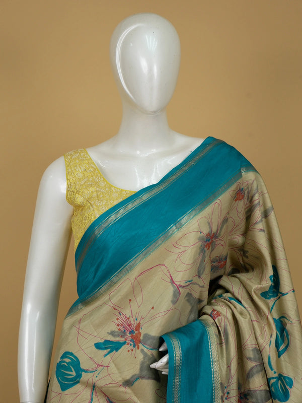 Beige and teal Dola silk saree with floral print and gold zari teal border