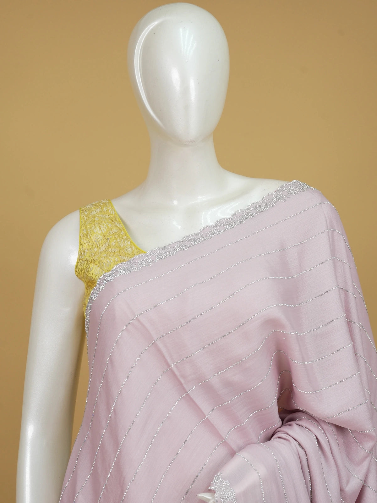 Lilac pink designer chiffon saree with silver sequin stripes and scalloped stone border