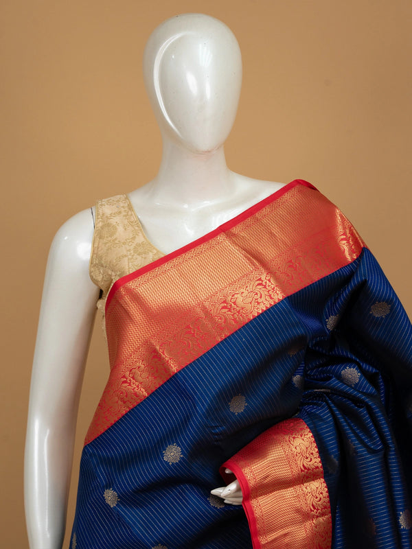 Navy blue pure Kanchipuram silk saree with gold zari stripes, floral buttas and contrast red gold zari border