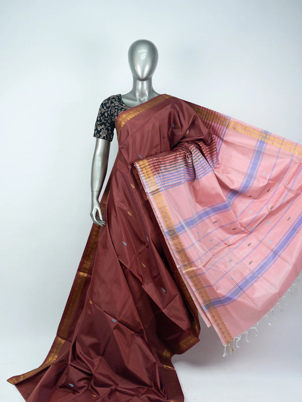 Maroon banana silk saree with contrast pink striped pallu and gold zari border