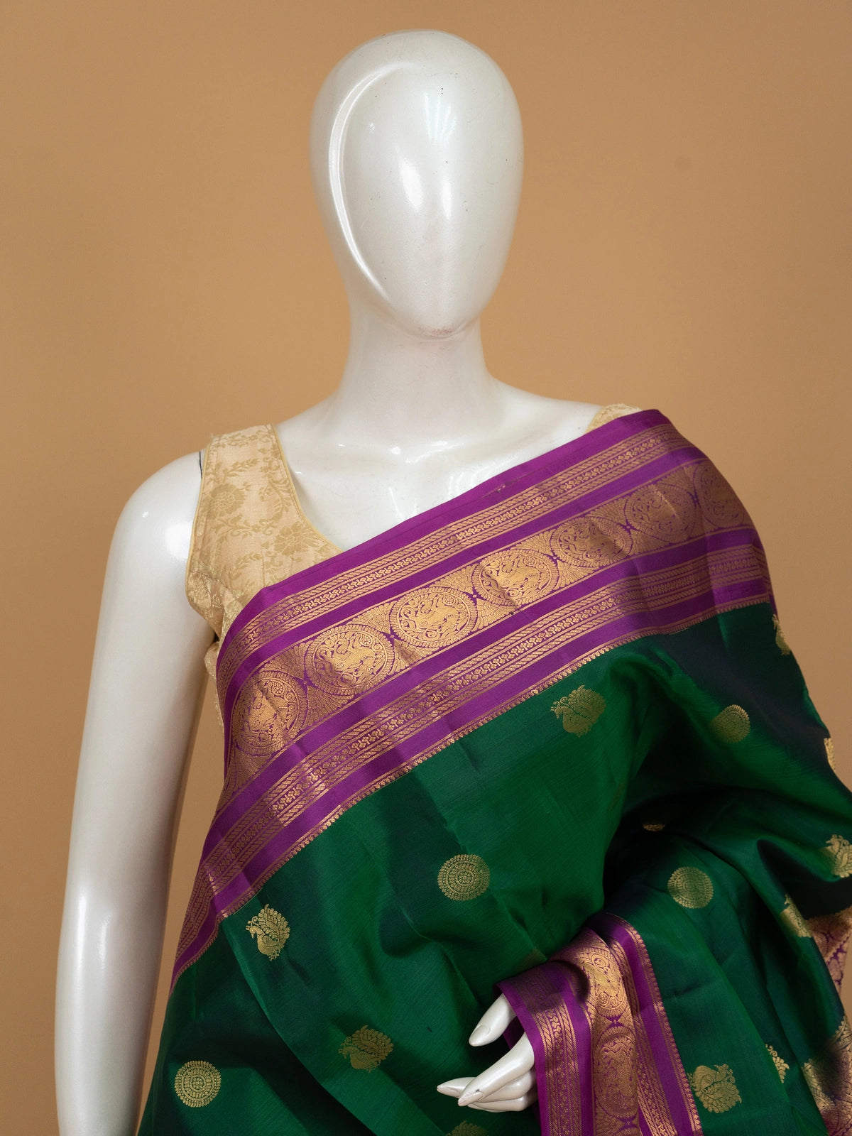 Green pure Kanchipuram silk saree with contrast magenta gold zari border and buttas