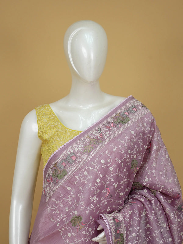 Lavender designer saree with white floral embroidery, bird and elephant motifs and pom-pom lace border