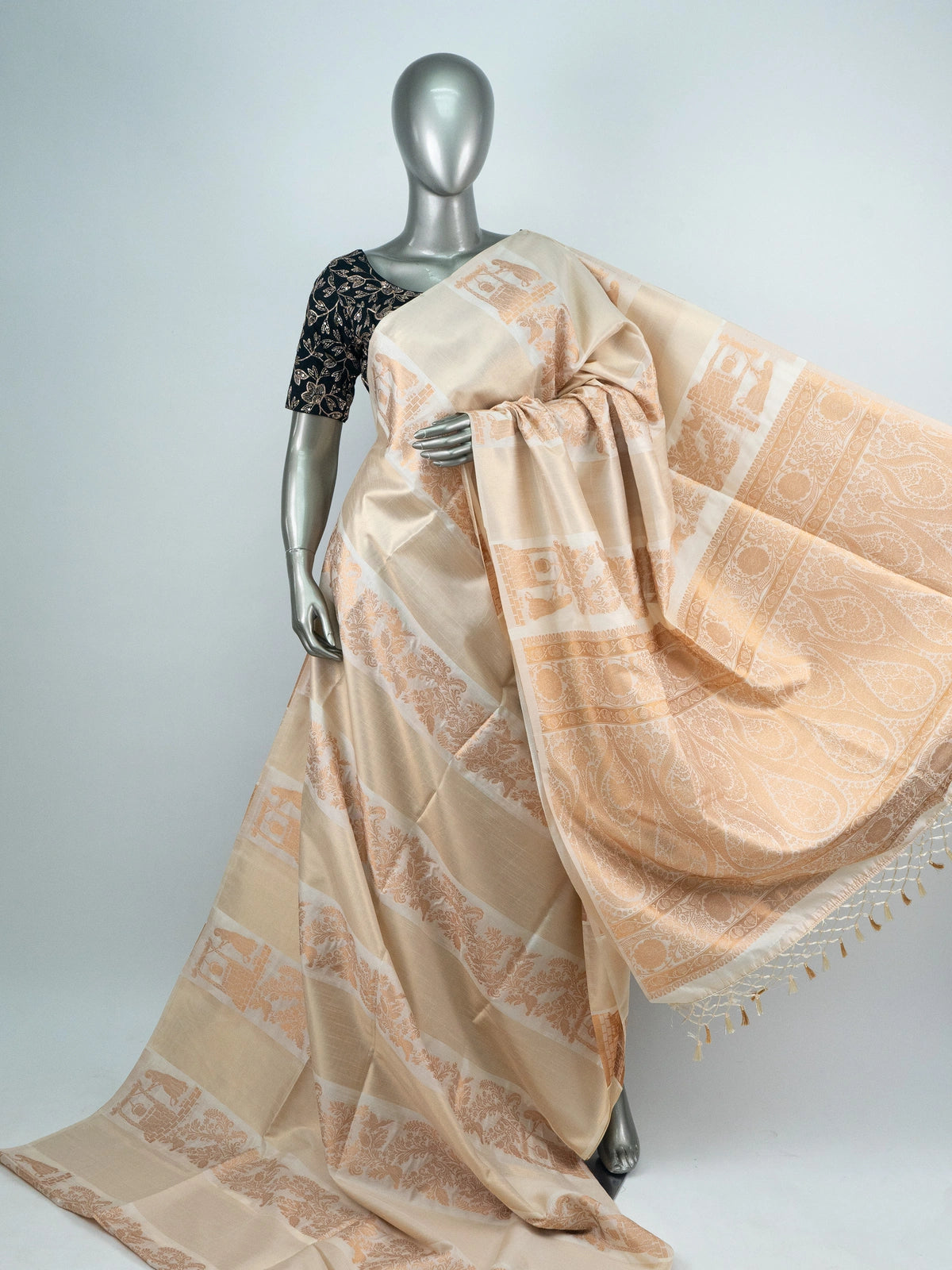 Cream semi raw silk saree with copper woven paisley and floral motifs and a contrasting embroidered black blouse