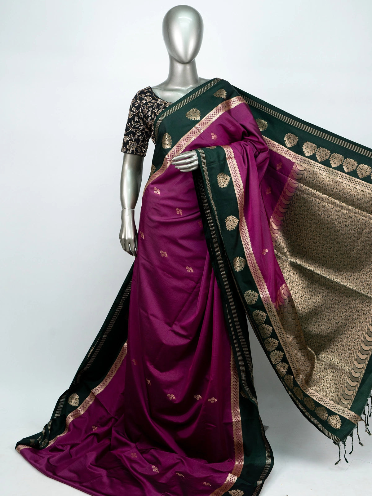 Magenta semi silk saree with dark green gold zari contrast border and floral buttas