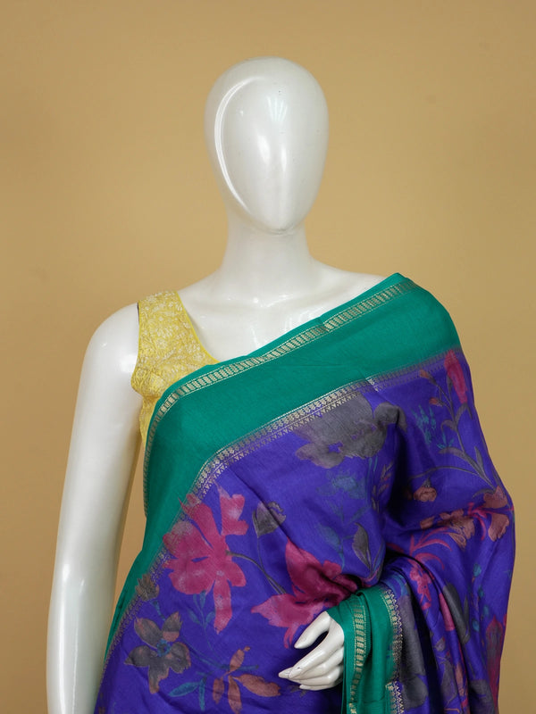 Violet blue Dola silk saree with floral print body and contrast teal green gold zari border