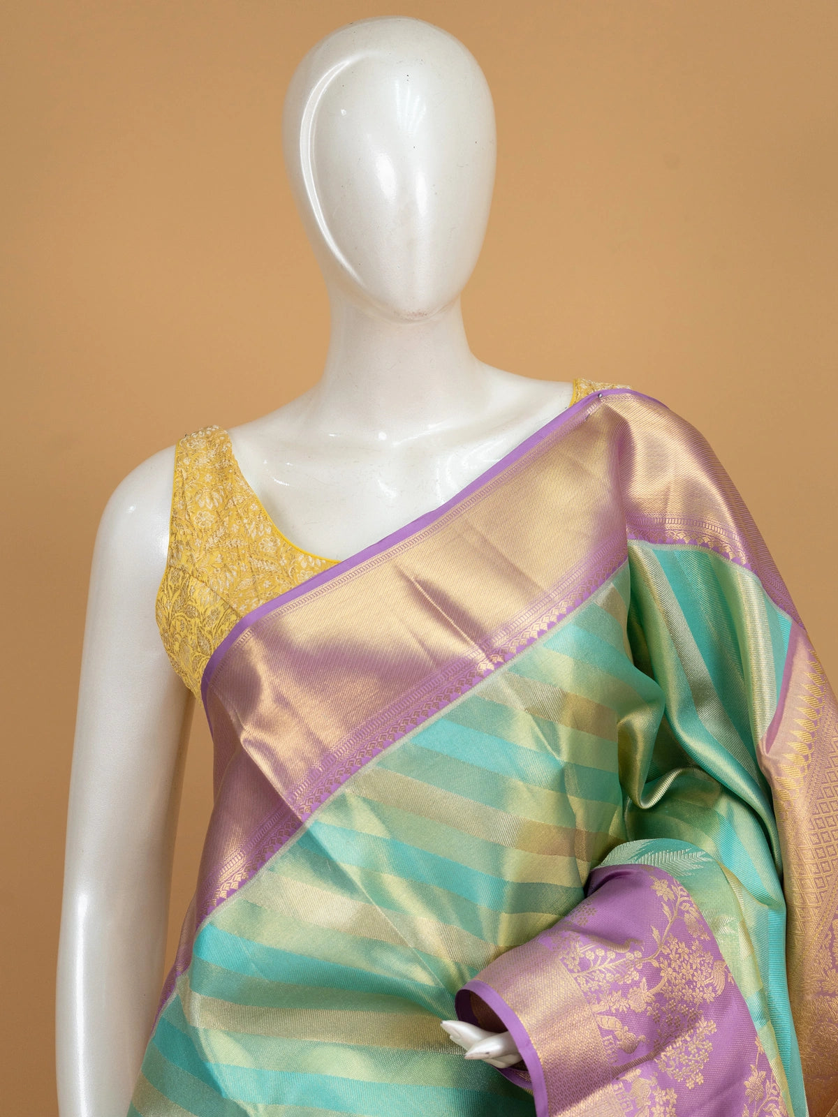 Turquoise green pure Kanchipuram silk saree with diagonal gold zari stripes and contrast lavender zari border