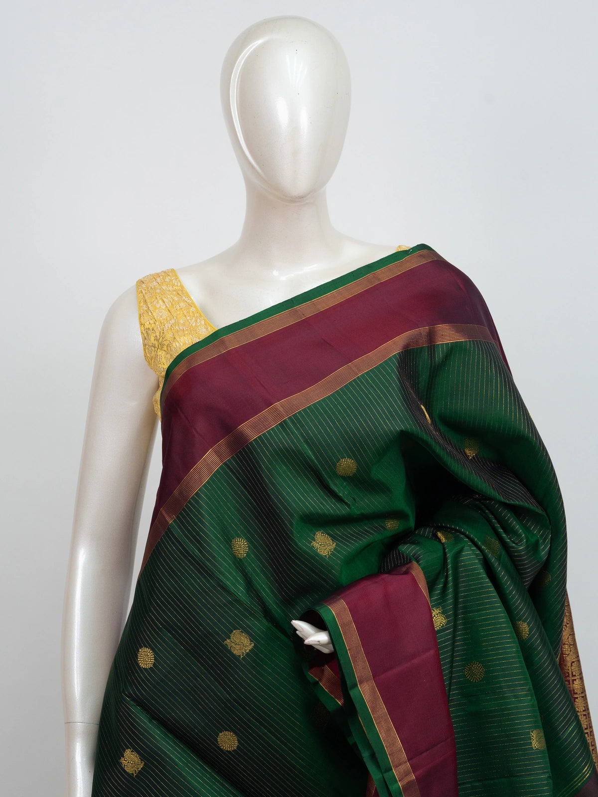 Green pure Kanchipuram silk saree with contrast maroon border and gold zari brocade pallu
