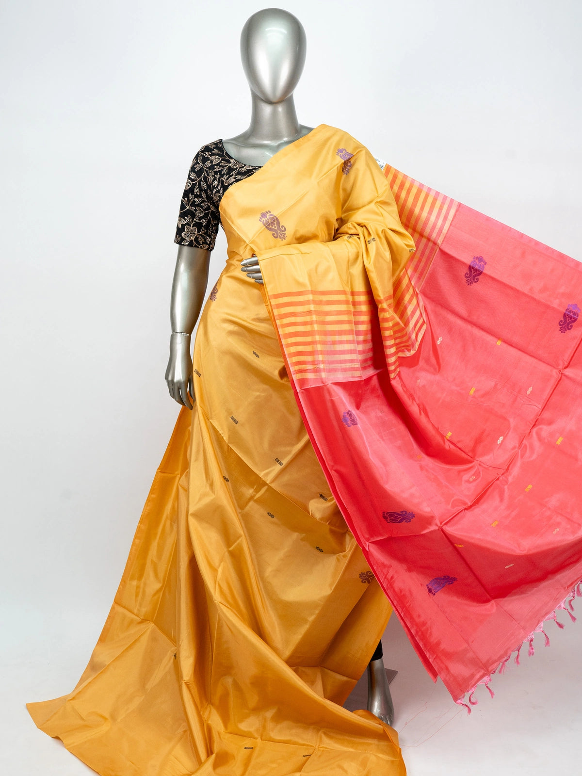 Mustard yellow banana silk saree with contrast pink pallu, purple paisley butis and gold zari work