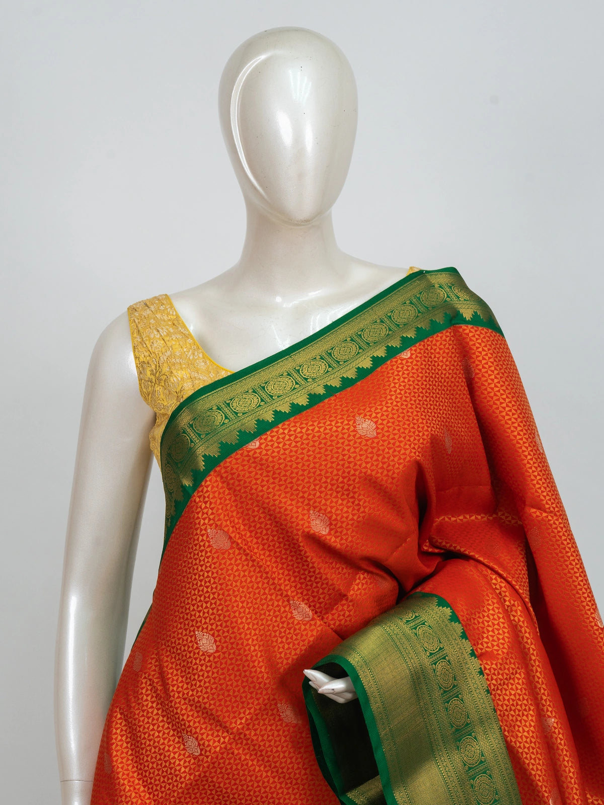 Orange Kanchipuram fancy silk saree with contrast green gold zari border and pallu