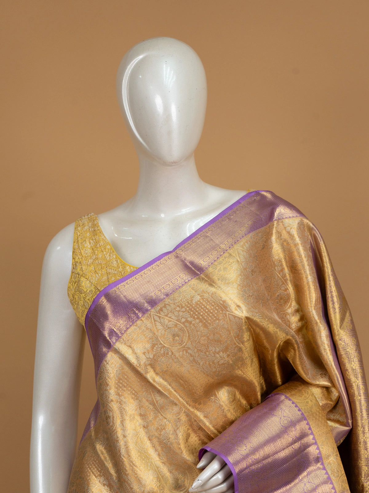 Gold pure Kanchipuram silk saree with contrast lavender zari border and peacock motif pallu