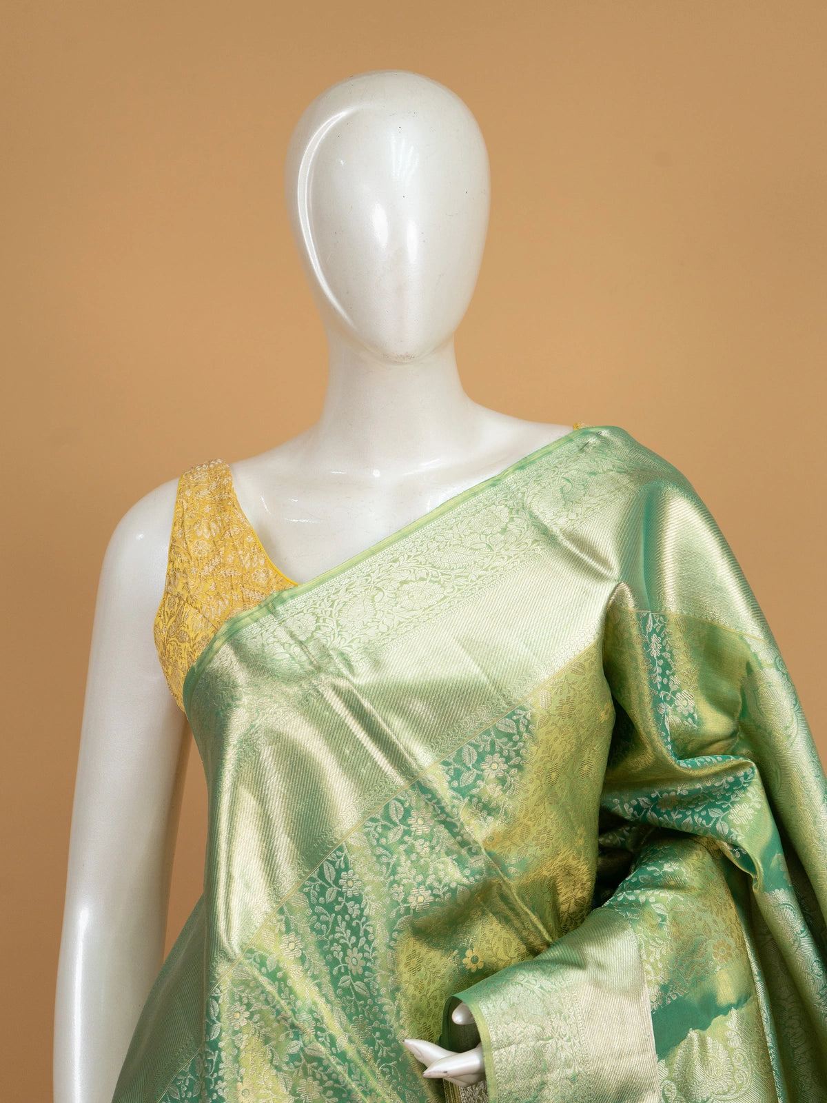 Green pure Kanchipuram silk saree with all-over gold zari floral jaal and broad zari border