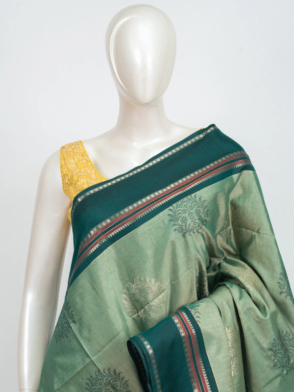 Sage green Kanchipuram fancy silk saree with contrast teal silver zari border and floral butta body