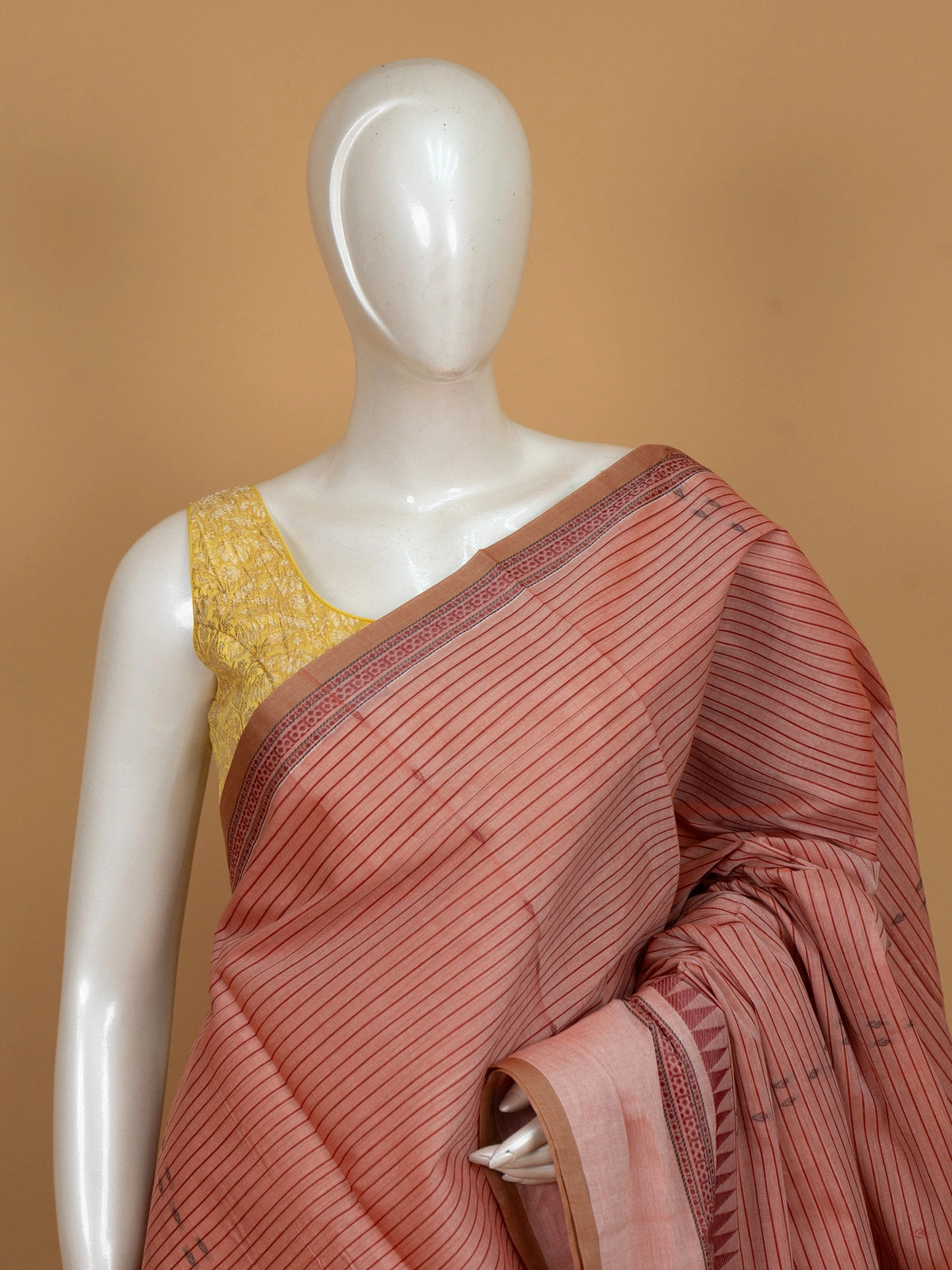 Peach semi raw silk saree with maroon stripes, temple border and paisley pallu