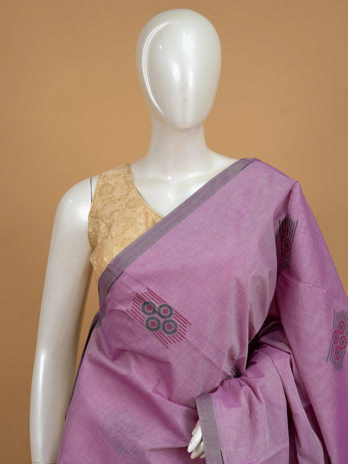 Mauve silk cotton saree with grey contrast border and woven circular buttas