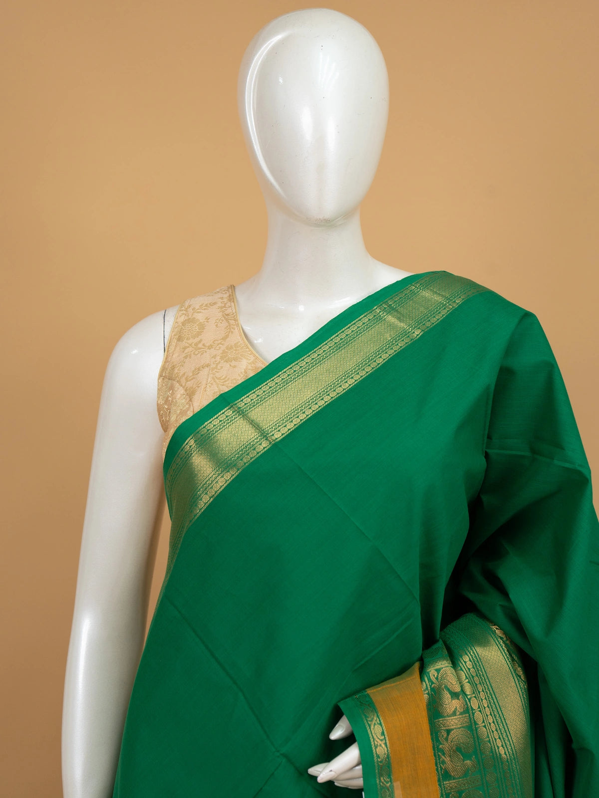 Green Chettinad cotton saree with gold zari peacock-motif border and striped pallu