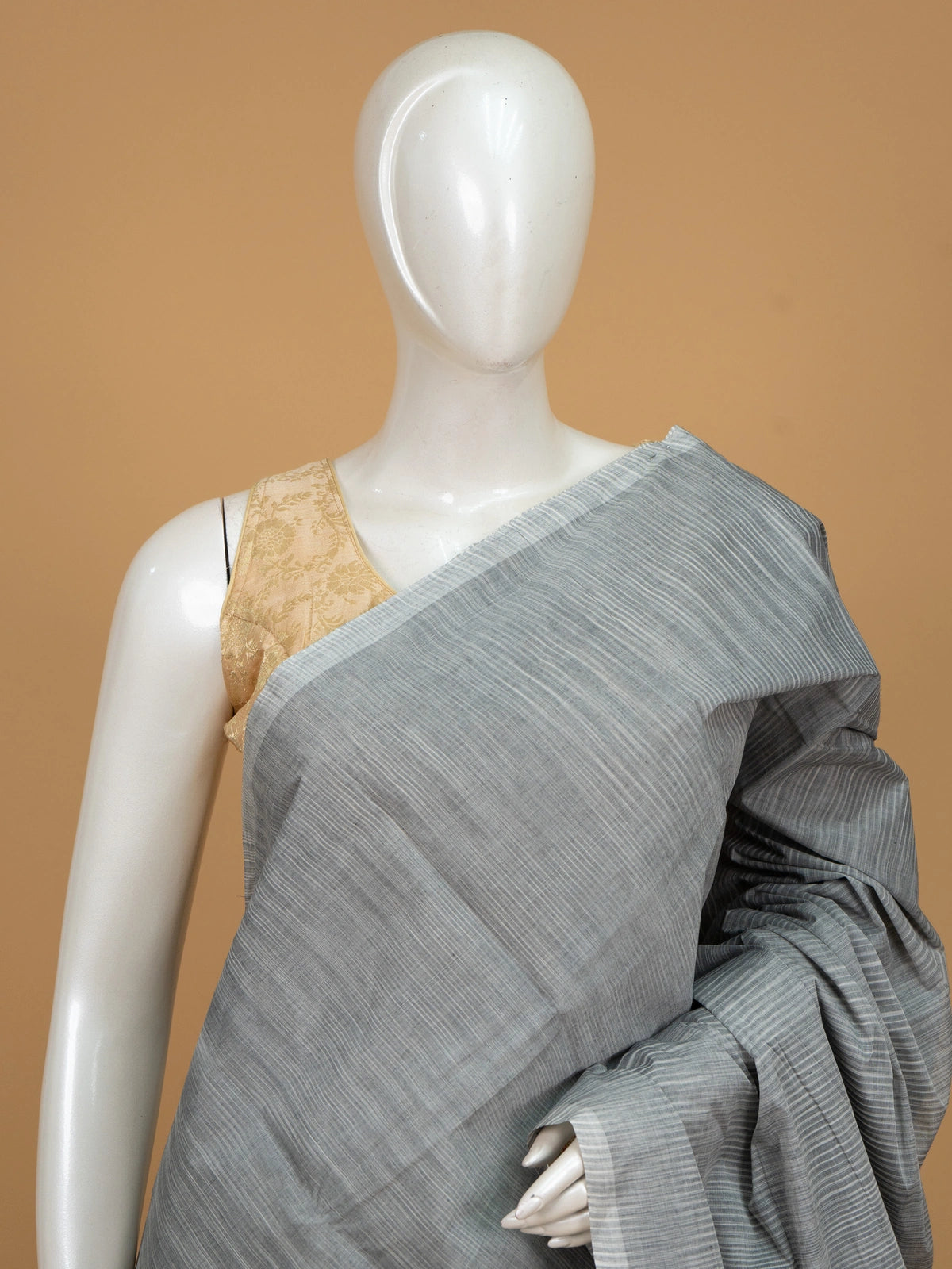 Grey silk cotton saree with striped texture, contrast beige border, and striped beige pallu