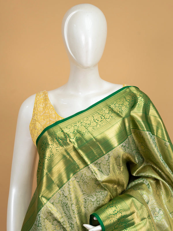 Green pure Kanchipuram silk saree with gold zari floral motifs and contrast border