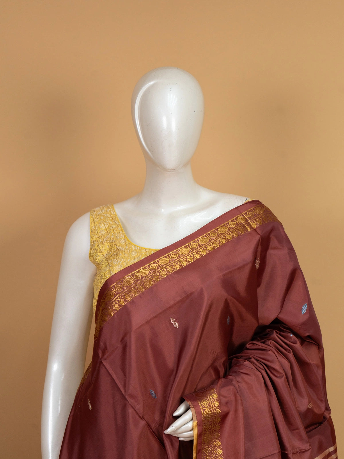 Maroon banana silk saree with mustard contrast pallu and gold zari border