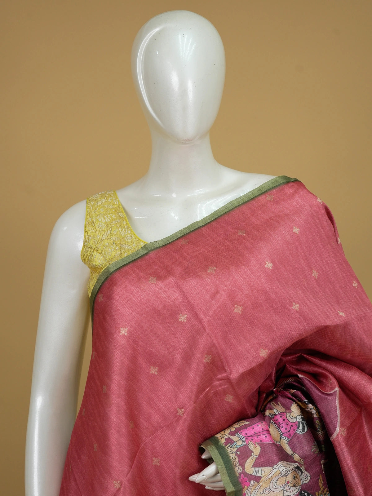 Rose pink semi tussar saree with gold butta body, green zari border and Pattachitra figurative pallu
