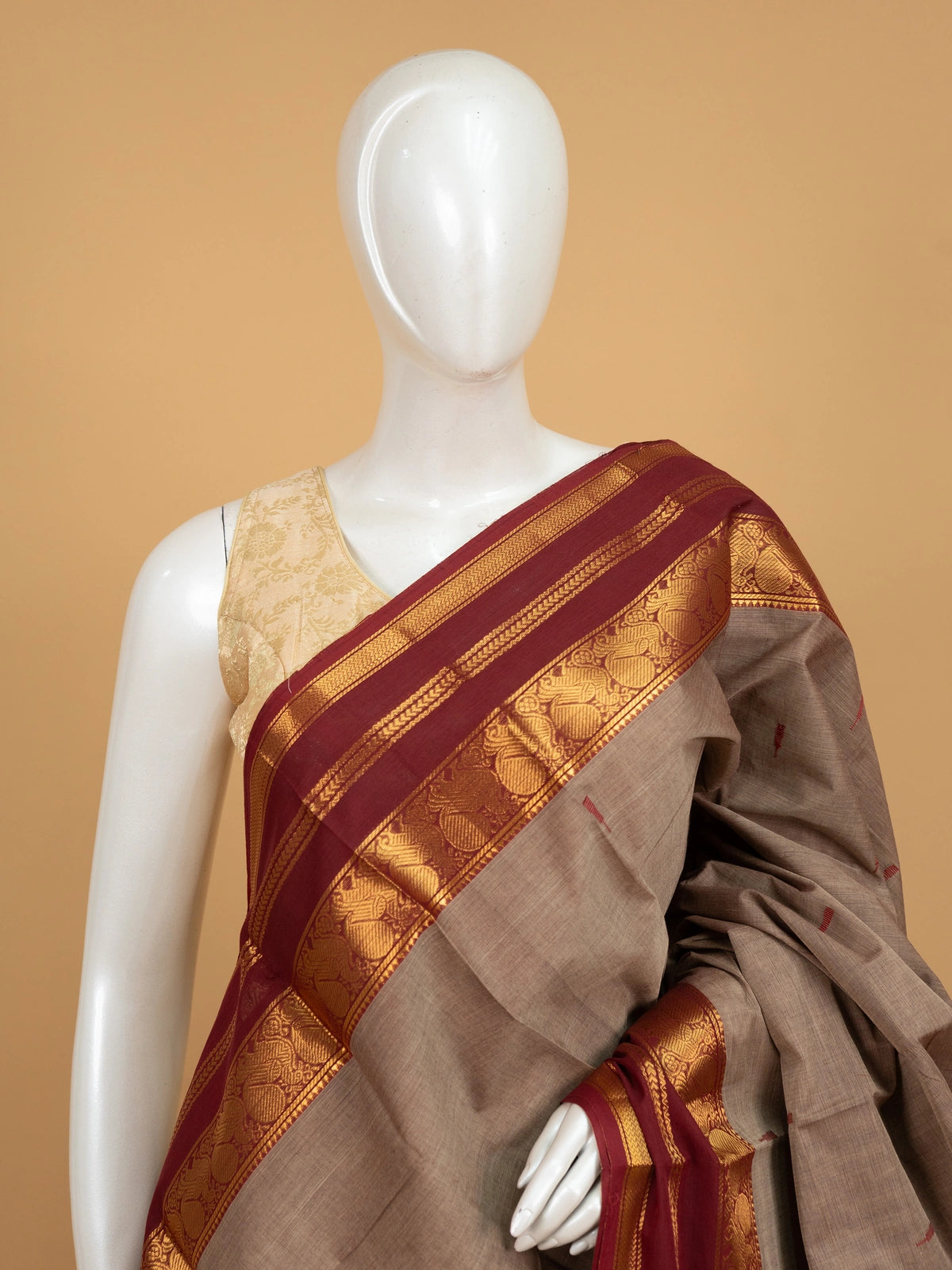 Taupe-grey Chettinad cotton saree with maroon and gold zari contrast border and red butta motifs