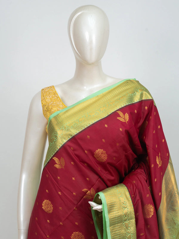 Maroon Kanchipuram fancy silk saree with contrast green and gold zari border and floral zari buttis