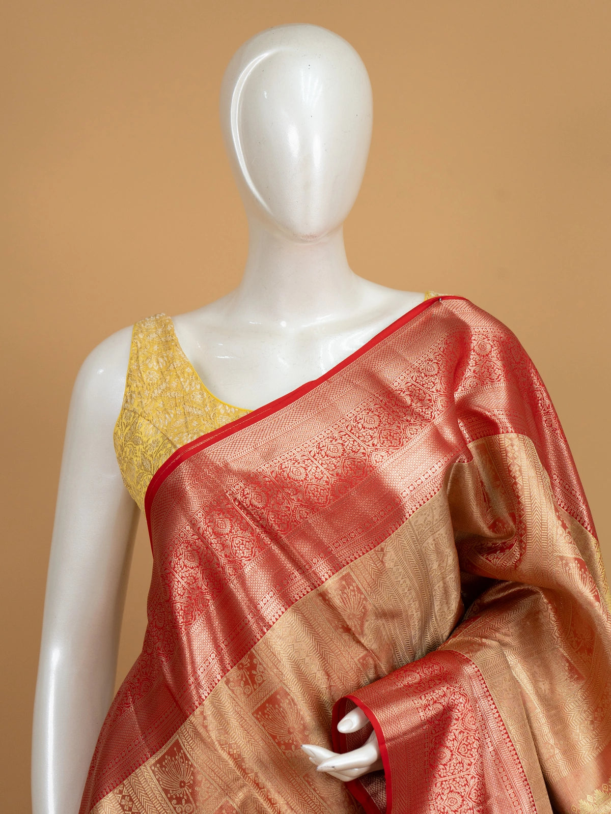 Gold and red pure Kanchipuram silk saree with gold zari brocade body and contrast red border