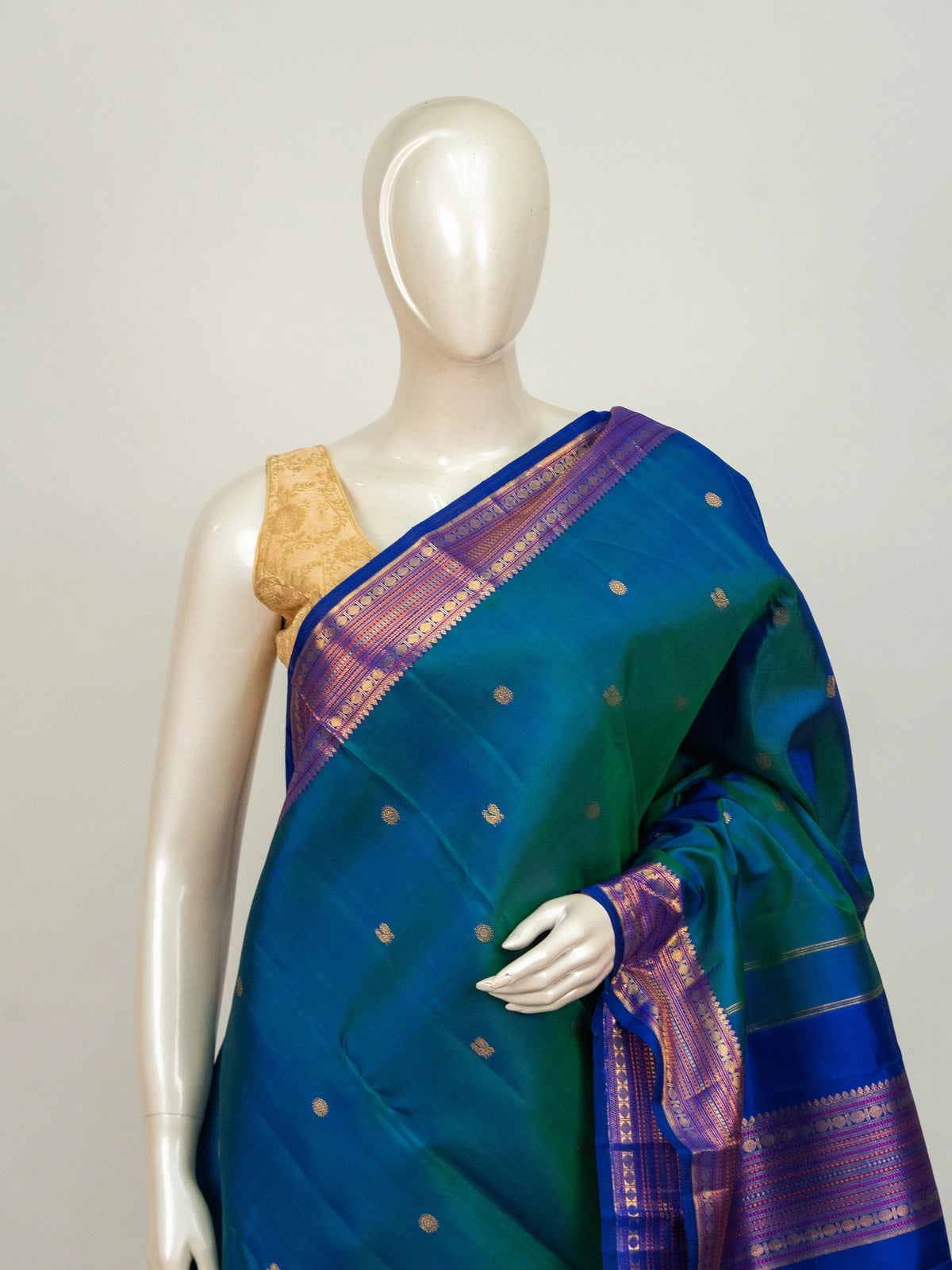 Peacock teal pure Kanchipuram silk saree with contrast royal blue gold zari border and woven pallu