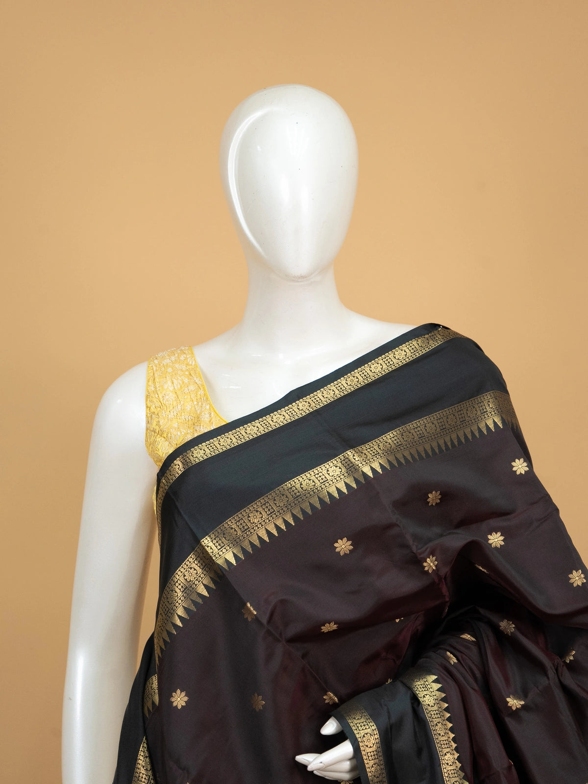 Wine brown Kanchi semi silk saree with contrast green and gold zari border and floral buttas