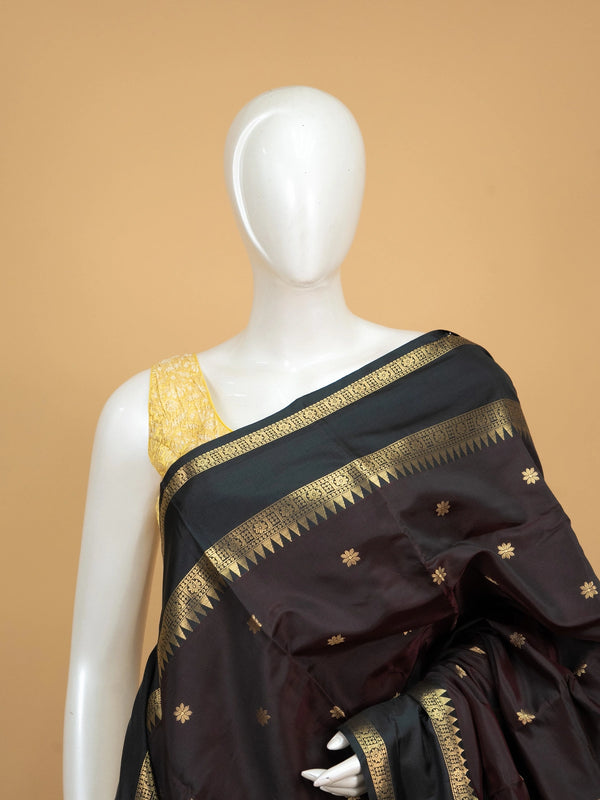 Wine brown Kanchi semi silk saree with contrast green and gold zari border and floral buttas