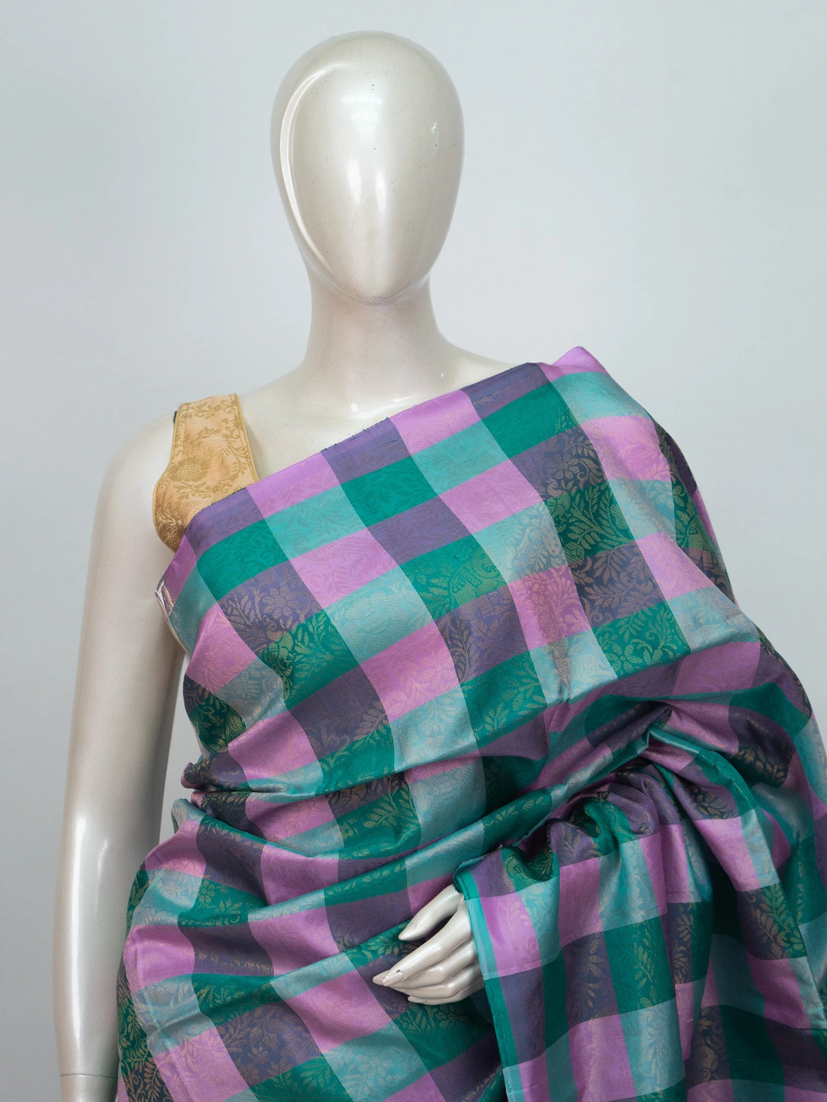 Green, pink and purple checked soft silk saree with gold zari folk-motif purple pallu